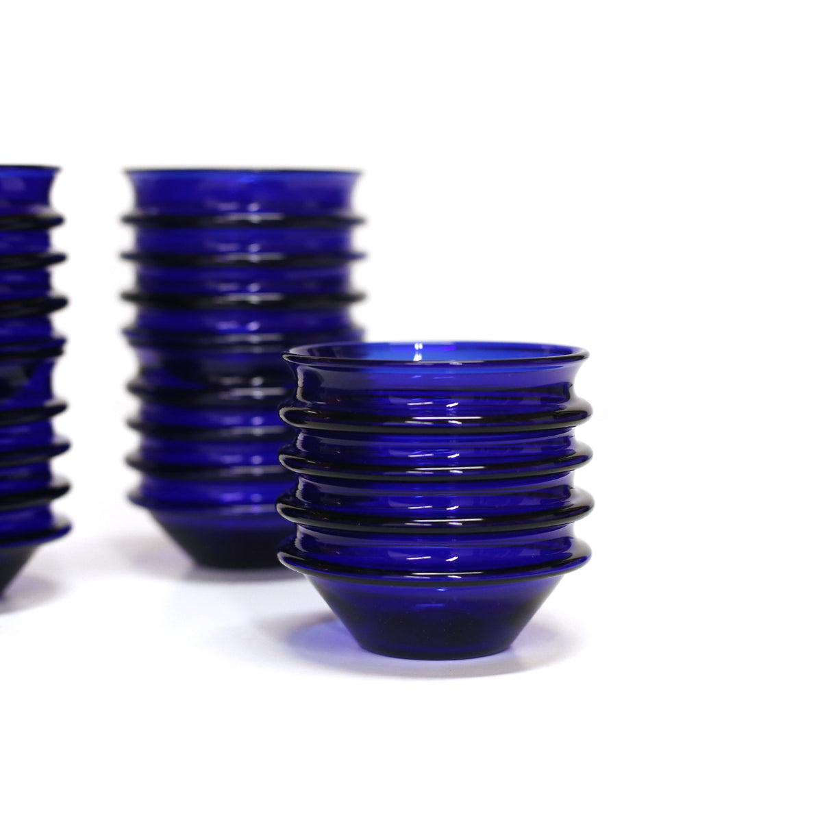 Stackable drinking glasses by Primitive Glass